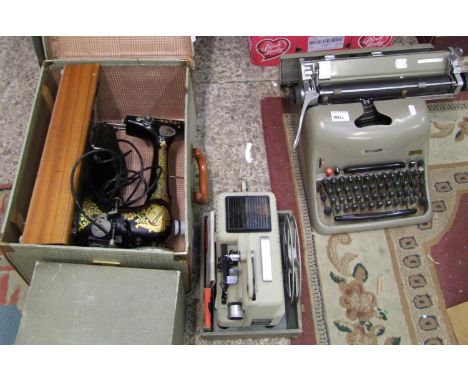 A Lexicon 80 vintage typewriter: plus a cased Eumic P8 projector and a cased Jones sewing machine (3). 