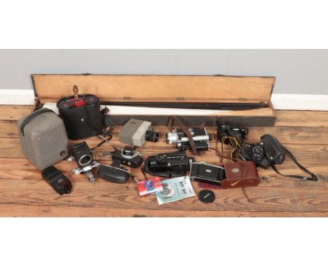 A box of photographic. Includes Regula, Praktica, Minolta Super8, Bell R-50 projector, boxed screen etc.  