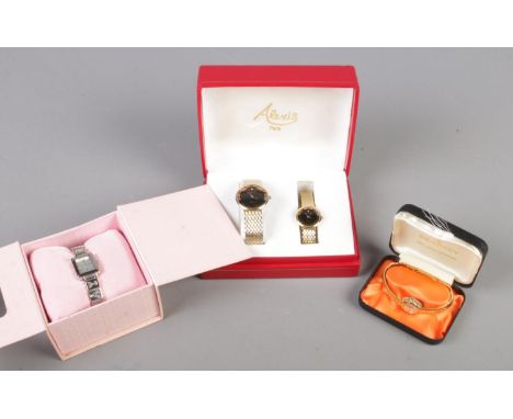 A collection of boxed watches. Includes Alexis his and hers quartz wristwatches, PlayBoy and a manual Regency watch.  