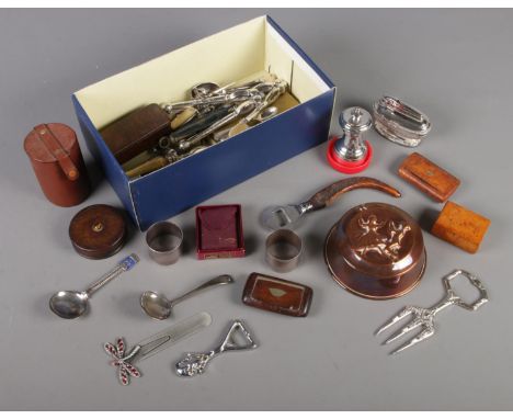 A box of collectables and metalwares. Includes butterfly paperclip, spoons, boxes, Ronson lighter, etc.  