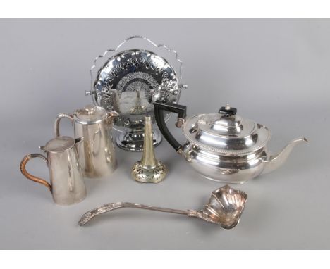A collection of silver plate including tea pot, ladle, milk jug, etc.  