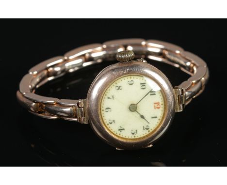 A ladies 9ct Gold manual wind cocktail wristwatch, with Swiss 15 Jewel Movement. With Arabic numeral dial and highlighted red