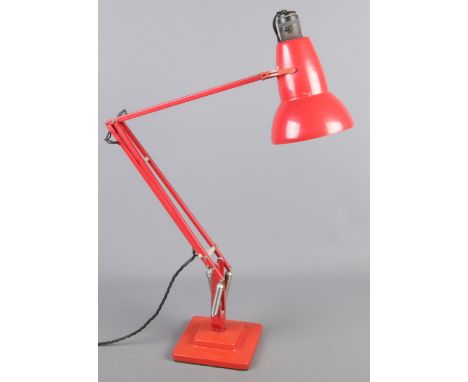 A Herbert Terry red angle poise lamp.  