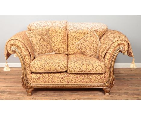 A Barker &amp; Stonehouse style two seater sofa with gilt and floral upholstery. Height 93cm, Width 180cm, Depth 110cm.  Sun 