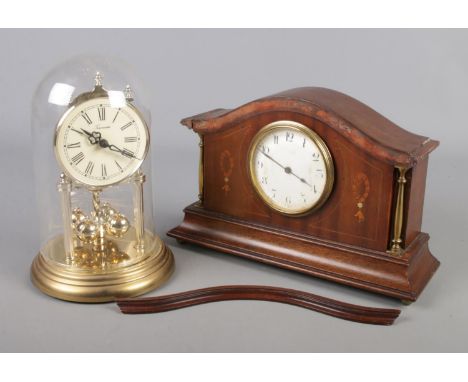 An inlaid mahogany Buren mantel clock, along with a TimeMaster torsion clock with glass dome.  