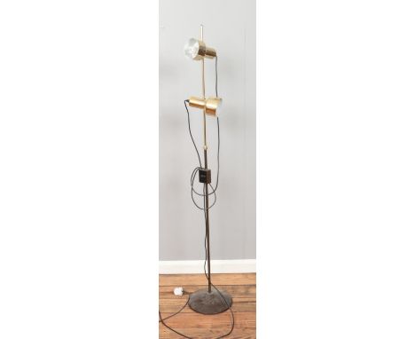 A vintage floor lamp featuring two adjustable lights on yellow metal and chrome support.  Working.
