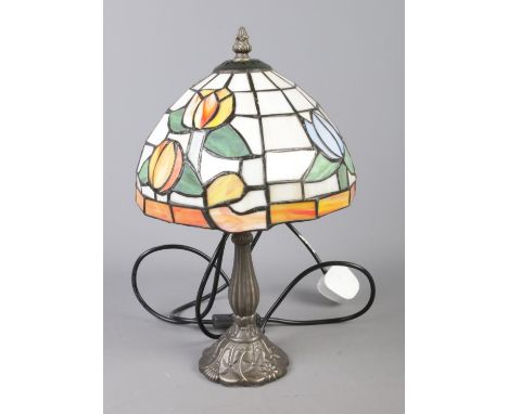 A Tiffany style desk lamp featuring floral tulip design.  
