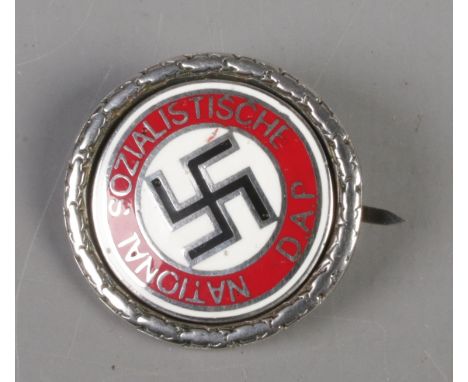 A German Third Reich silver and enamel NSDAP badge. Stamped 800.  