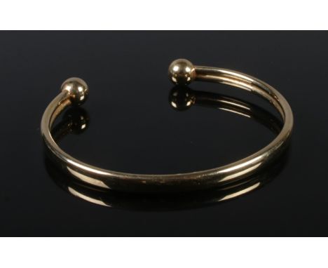 A 9ct gold bangle. 4.54g.  