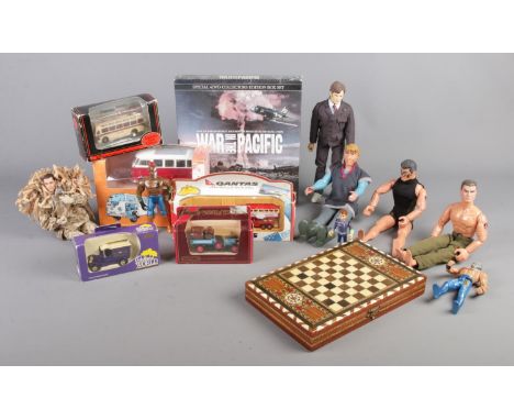 A collection of assorted items, to include backgammon board, boxed diecast cars and action man figures.  