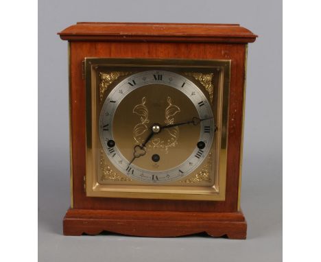 An Elliot mantle clock by Burrell Sheffield featuring eight day lever Westminster and Whittington chime.  Working order.