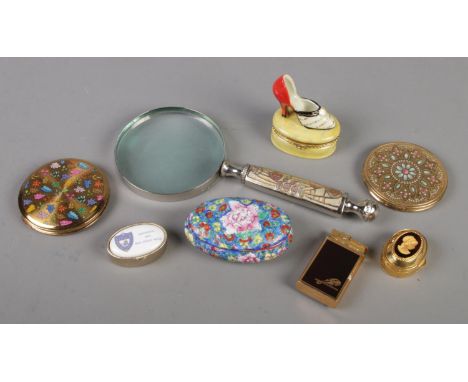 A Mackintosh style magnifying glass, along with a collection of pill boxes, compacts, musical lighter etc.  