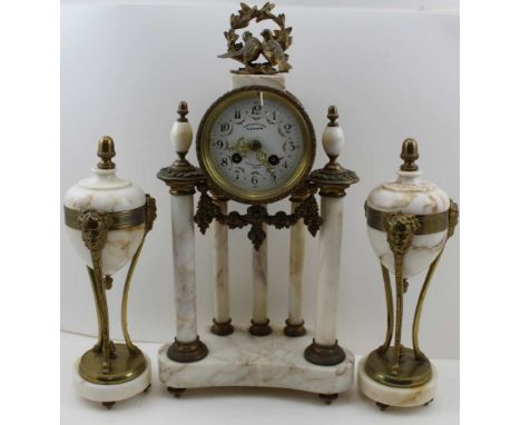 A LATE 19TH CENTURY FRENCH ALABASTER &amp; GILT METAL CLOCK GARNITURE, the clock raised on column, with love bird mount, the 