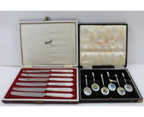A SET OF SIX 20TH CENTURY SILVER GILT &amp; ENAMEL COFFEE SPOONS, each decorated with different flowers to the bowl backs, ca