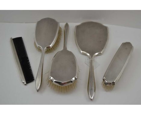 MAPPIN &amp; WEBB, A SILVER BACKED FIVE-PIECE DRESSING TABLE SET, engine turned decoration, comprising hand vanity mirror, pa