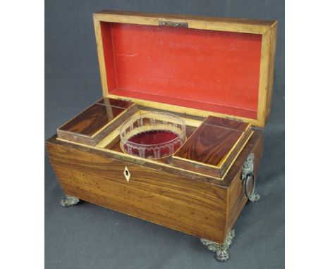 EARLY 19TH CENTURY ROSEWOOD RECTANGULAR, SARCOPHAGUS SHAPED TEA CADDY, having gilt metal loop handles, and raised on gilt met