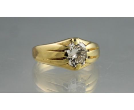 A YELLOW METAL GYPSY SET SOLITAIRE DIAMOND RING.  The brilliant cut stone an estimated 1.50cts approx.  Ring size M&1/2.(B.P.