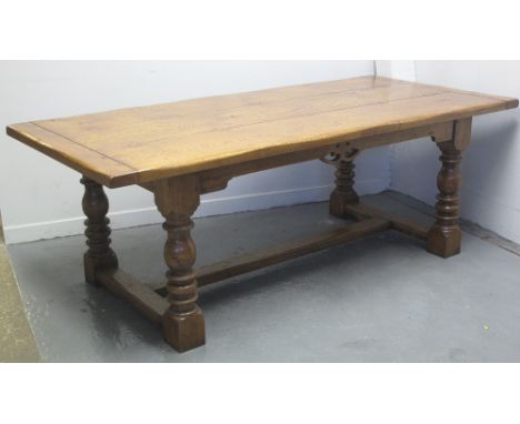 17TH CENTURY STYLE OAK REFECTORY TABLE, having cleated three plank top above pierced frieze on baluster and ring turned legs 