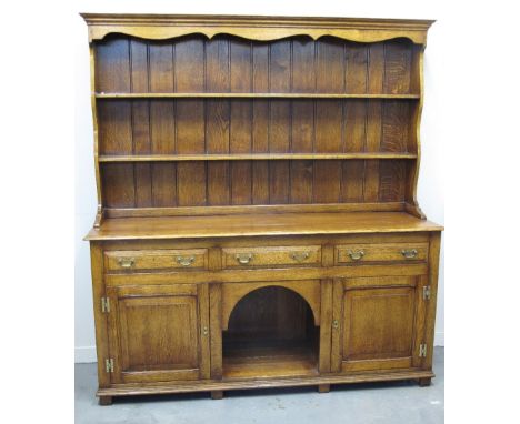 GOOD QUALITY REPRODUCTION OAK DRESSER, having boarded two shelf rack back over a base with three moulded frieze drawers above