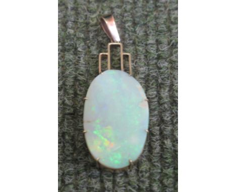 LARGE OVAL OPAL PENDANT in yellow metal Art Deco style setting.  Opal 29 x 18mm.(B.P. 24% incl. VAT)   CONDITION REPORT:  Goo