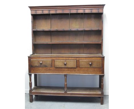 EARLY 19TH CENTURY WELSH OAK POTBOARD DRESSER having boarded two shelf rack back under a moulded cornice with original iron h