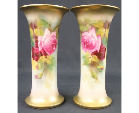 TWO SIMILAR ROYAL WORCESTER PORCELAIN TRUMPET VASES, hand painted with pink roses and foliage, signed by K. Blake, shape no.: