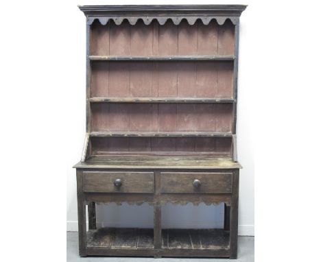 EARLY 19TH CENTURY WELSH OAK POT BOARD DRESSER, having boarded three shelf rack back with moulded cornice over shaped frieze,