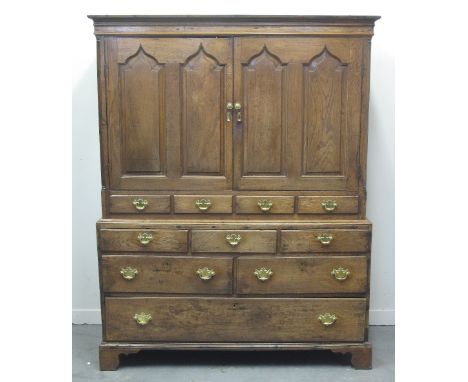 18TH CENTURY WELSH OAK TWO STAGE LOW PRESS CUPBOARD, having moulded cornice above a pair of ogee pointed, arched panelled doo