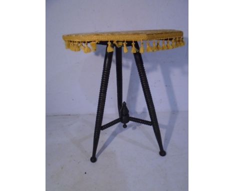 A turn of the century gypsy table with ebonised bobbin legs