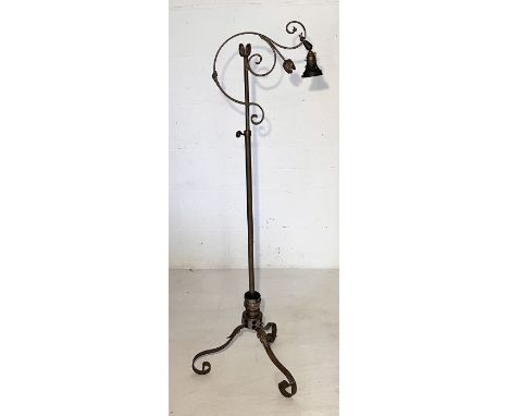 An Art Nouveau wrought metal floor lamp on scrolled feet with foliate detail - height 130cm