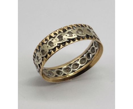 An unmarked 9ct gold and silver eternity ring, weight 3.4g