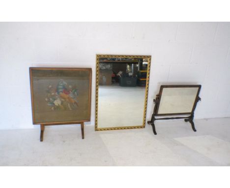 A gilt framed wall mirror, along with a toilet mirror and a fire screen (converts to table).