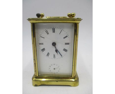 A turn of the century brass carriage clock with alarm