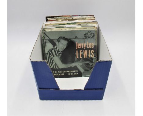 A collection of 7" vinyl records including The Beatles, The Rolling Stones, John Lennon, Elton John, The Who, Jerry Lee Lewis