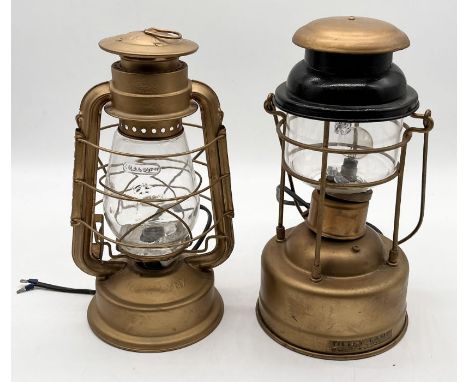 Two painted lanterns including a Tilley Lamp and one other