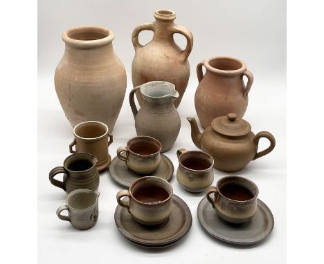 A collection of terracotta vases and studio pottery including teapot and four cups and saucers 