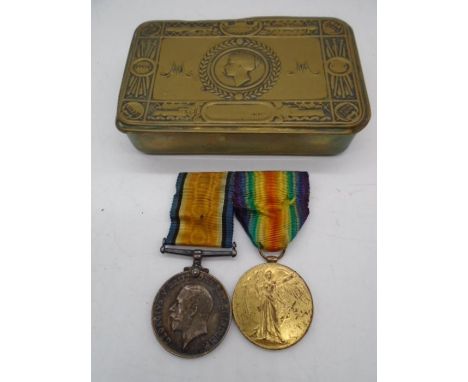 A Queen Mary Christmas 1914 tin with two WWI medals awarded to 79817, A. Sgt V. A. Allemande, Royal Army Medical Corps