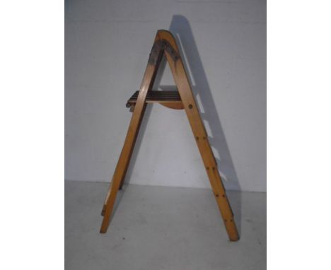A vintage wooden step ladder