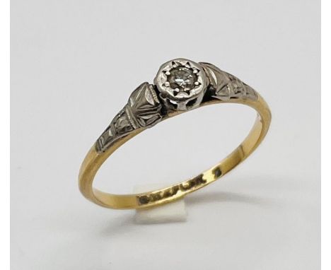 An 18ct gold and platinum ring set with a diamond, weight 2g