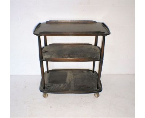 An Ercol dark wood tea trolley.