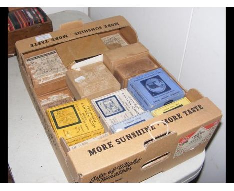 A box containing a selection of coloured magic lantern slides, Junior Lecturers series and other