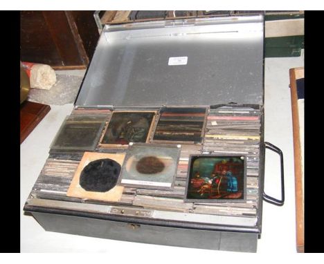 A metal box containing interesting magic lantern slides of various subjects