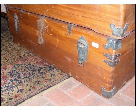 A metal bound trunk with side handles