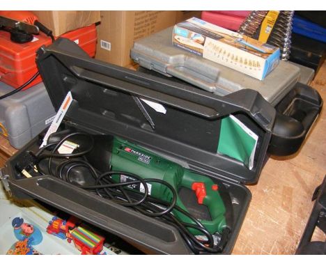 A Parkside sabre saw, Black &amp; Decker drill, socket set and other tools 