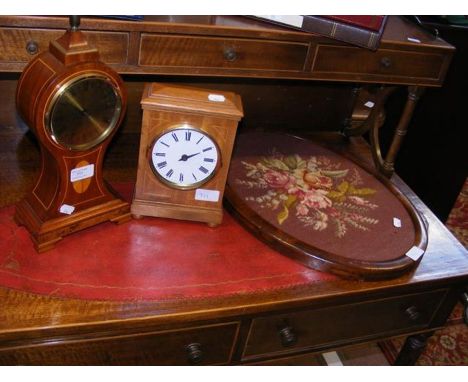 A Syril Tucker inlaid balloon mantle clock together with one other mantle clock and an oval tapestry