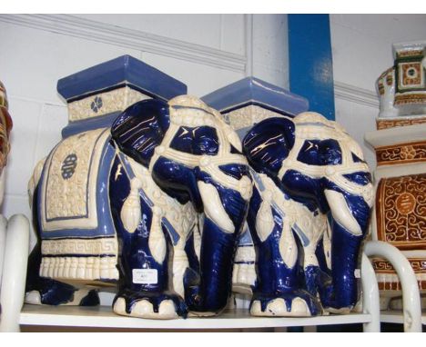 A pair of blue glazed ceramic elephant seats 