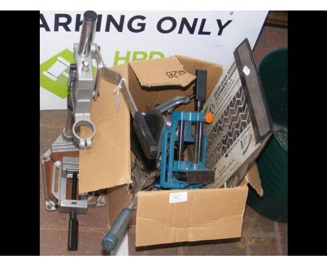 A workbench drill vice, together with other tools 