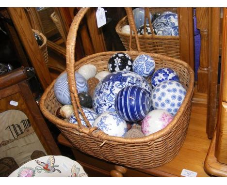 A basket of ceramic ball and egg ornaments etc