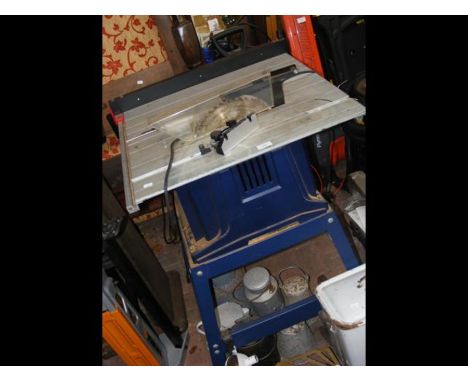 A circular saw on metal bench