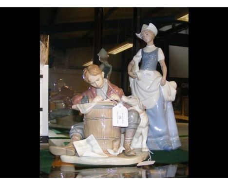 A large Lladro figure of boy with dog, together with a Spanish ceramic figure of lady